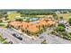 Community center with refreshing swimming pool, lush landscaping, and convenient parking at 2101 Cypress Cross Dr, Lakeland, FL 33810
