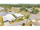 Overhead shot of home by pond, showcasing manicured lawn and proximity to community amenities at 2101 Cypress Cross Dr, Lakeland, FL 33810