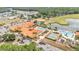 Community center with multiple pools, golf course, and verdant landscaping at 2101 Cypress Cross Dr, Lakeland, FL 33810