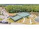 Community tennis courts and bocce ball with verdant landscaping and ample parking at 2101 Cypress Cross Dr, Lakeland, FL 33810