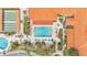 Immaculate resort-style pool and shuffleboard court surrounded by lush landscaping and resort buildings at 2101 Cypress Cross Dr, Lakeland, FL 33810
