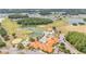 Picturesque aerial view of the community golf course, pools, clubhouse, and surrounding neighborhoods at 2101 Cypress Cross Dr, Lakeland, FL 33810