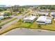 Aerial view of home near pond, highlighting the green space and community features, perfect for serene living at 2101 Cypress Cross Dr, Lakeland, FL 33810