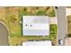 Overhead view of home near a pond with lush lawn and convenient access to community roads and pathways at 2101 Cypress Cross Dr, Lakeland, FL 33810