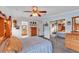 Bedroom featuring carpeted floors, a comfortable bed, and ample storage at 2101 Cypress Cross Dr, Lakeland, FL 33810