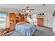 Comfortable bedroom with built-in storage and carpeted floor at 2101 Cypress Cross Dr, Lakeland, FL 33810