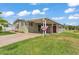Charming single-story home featuring a carport, red shutters, and green lawn at 2101 Cypress Cross Dr, Lakeland, FL 33810