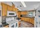 Bright kitchen featuring light wood cabinets, a breakfast bar, and modern appliances at 2101 Cypress Cross Dr, Lakeland, FL 33810
