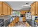 Spacious kitchen featuring granite countertops, ample cabinetry, and a stainless steel sink at 2101 Cypress Cross Dr, Lakeland, FL 33810