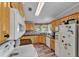 Well-lit kitchen featuring wooden cabinets, dark countertops, and modern appliances at 2101 Cypress Cross Dr, Lakeland, FL 33810