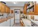 Functional laundry room with washer, dryer, storage cabinets, and counter space at 2101 Cypress Cross Dr, Lakeland, FL 33810