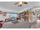 Spacious living room featuring a large entertainment center, comfortable seating, and neutral tones at 2101 Cypress Cross Dr, Lakeland, FL 33810