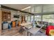 Bright sunroom with view of water, storage, and workspace; perfect for relaxation or crafts at 2101 Cypress Cross Dr, Lakeland, FL 33810