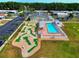 Community aerial view showcasing a pool, mini golf course, and recreational area at 211 Sweet Cir, Winter Haven, FL 33884