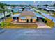 Aerial view of a charming single-story residence with a covered parking and well-manicured lawn at 211 Sweet Cir, Winter Haven, FL 33884