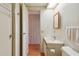 Functional bathroom features a single sink vanity and a toilet, providing essential amenities at 211 Sweet Cir, Winter Haven, FL 33884