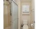 Cozy bathroom with a standing shower, toilet, and a mounted medicine cabinet at 211 Sweet Cir, Winter Haven, FL 33884