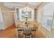 Dining room featuring a chandelier, a table with 4 chairs, and a built in serving buffet at 211 Sweet Cir, Winter Haven, FL 33884
