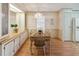 Dining room featuring a chandelier, a table with 4 chairs, and a built in serving buffet at 211 Sweet Cir, Winter Haven, FL 33884