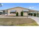 Inviting single-story home featuring a covered parking area and well-maintained landscaping at 211 Sweet Cir, Winter Haven, FL 33884