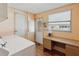 This well-lit laundry room features vinyl floors, workspace, window, and door to exterior at 211 Sweet Cir, Winter Haven, FL 33884