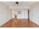 Inviting living room with ceiling fan, wood flooring and an open design, with access to the bathroom at 211 Sweet Cir, Winter Haven, FL 33884