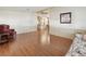 Spacious living room with laminate floors leading to the kitchen and dining area at 211 Sweet Cir, Winter Haven, FL 33884