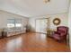 Spacious living room with laminate flooring, neutral walls, and comfortable furnishings at 211 Sweet Cir, Winter Haven, FL 33884