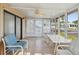 Enclosed sun room featuring tile floor, and large windows that allow plenty of natural light at 211 Sweet Cir, Winter Haven, FL 33884