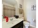 Clean bathroom featuring a modern sink, decorative mirror, and neutral decor for a relaxing ambiance at 2112 Betsy Ross Ln, St Cloud, FL 34769