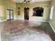 Spacious clubhouse interior with tile flooring, arched doorways, and a convenient kitchenette at 2112 Betsy Ross Ln, St Cloud, FL 34769