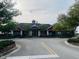 Community clubhouse featuring manicured landscaping and elegant architectural details at 2112 Betsy Ross Ln, St Cloud, FL 34769