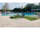 Community pool featuring lounge chairs, sun deck and outdoor seating with shade at 2112 Betsy Ross Ln, St Cloud, FL 34769
