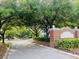 Welcoming entrance to the community, featuring lush landscaping and a brick signage at 2112 Betsy Ross Ln, St Cloud, FL 34769