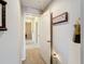 Hallway featuring neutral paint, carpet, decor and an open doorway at 2112 Betsy Ross Ln, St Cloud, FL 34769