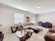 Inviting living room with a comfortable couch, stylish tables, and a well-lit interior with tile floors at 2112 Betsy Ross Ln, St Cloud, FL 34769