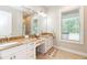 Elegant bathroom features a double vanity with granite countertops and ample natural light at 2115 W Pipkin Rd, Lakeland, FL 33811