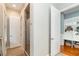 Well-lit bathroom featuring a glass shower, tile floors, and white paneled doors leading to closet and hallway at 2115 W Pipkin Rd, Lakeland, FL 33811