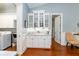 Charming butler pantry features marble countertops and stylish white cabinets, perfect for entertaining at 2115 W Pipkin Rd, Lakeland, FL 33811