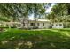 Landscaped backyard of home with patio at 2115 W Pipkin Rd, Lakeland, FL 33811
