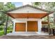 Garage exterior featuring two doors and a covered extension at 2115 W Pipkin Rd, Lakeland, FL 33811