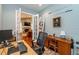Bright home office featuring furniture, area rug, neutral paint, and wood flooring at 2115 W Pipkin Rd, Lakeland, FL 33811