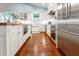 Modern kitchen boasts stainless steel appliances, butcher block island, and ample cabinet space at 2115 W Pipkin Rd, Lakeland, FL 33811