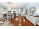 Spacious kitchen features white cabinets, wood floors, stainless steel appliances, and a large island with bar seating at 2115 W Pipkin Rd, Lakeland, FL 33811