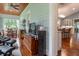 Open living room showcases wood floors and seamlessly connects to the kitchen, promoting togetherness at 2115 W Pipkin Rd, Lakeland, FL 33811