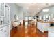 Open-concept living room with hardwood floors, vaulted ceilings, and fireplace is perfect for gatherings at 2115 W Pipkin Rd, Lakeland, FL 33811