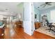 Bright living space flows into a well-equipped kitchen, highlighted by hardwood floors and a built-in bookcase at 2115 W Pipkin Rd, Lakeland, FL 33811