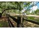 Sprawling property with mature trees and fenced perimeter at 2115 W Pipkin Rd, Lakeland, FL 33811