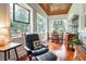Cozy sunroom filled with natural light, offering comfortable seating and views of the tranquil outdoors at 2115 W Pipkin Rd, Lakeland, FL 33811