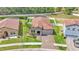 Wide aerial view showcases landscaping, clay tile roofs, and a well-maintained neighborhood at 2277 Bella Luna Cir, Lakeland, FL 33810
